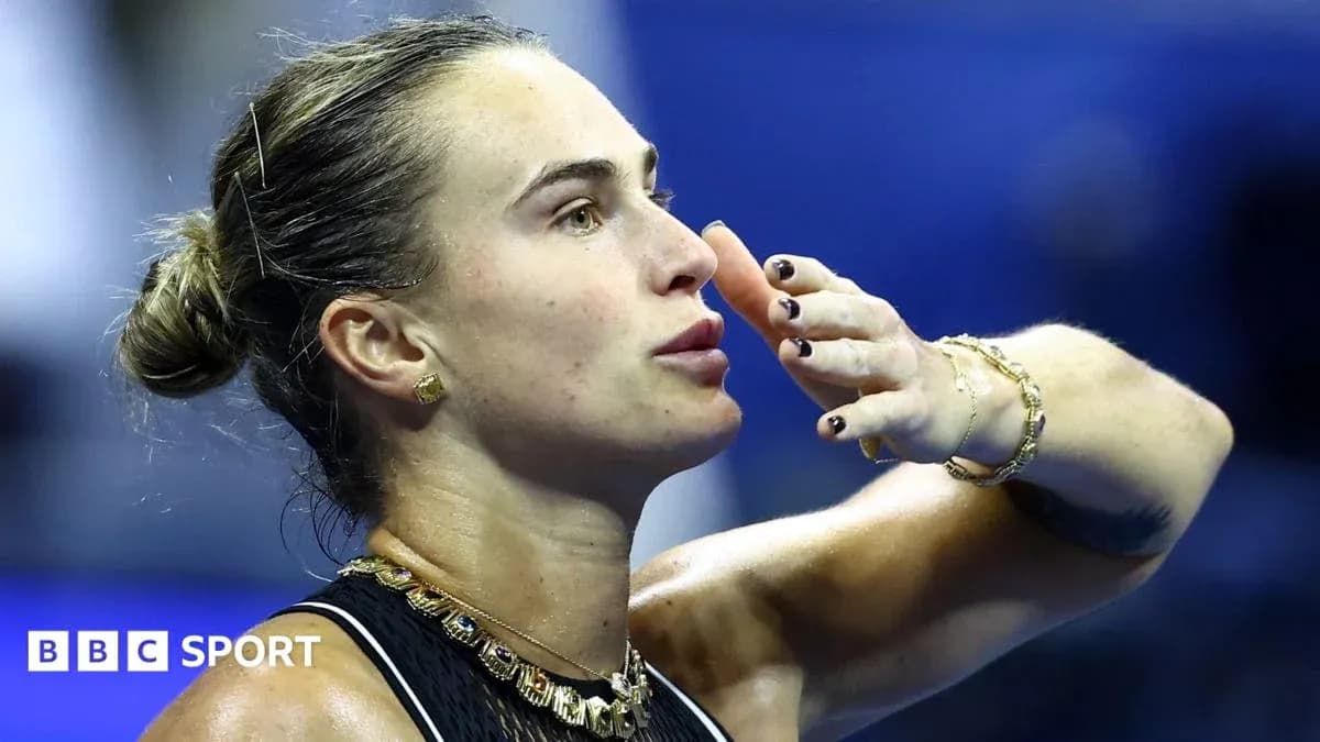 Tennis player blowing a kiss during match