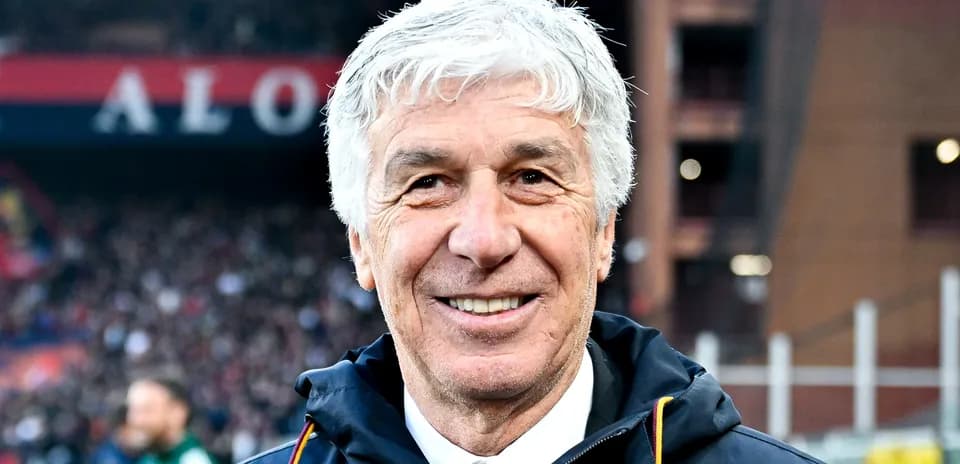 Smiling coach on the sidelines at stadium