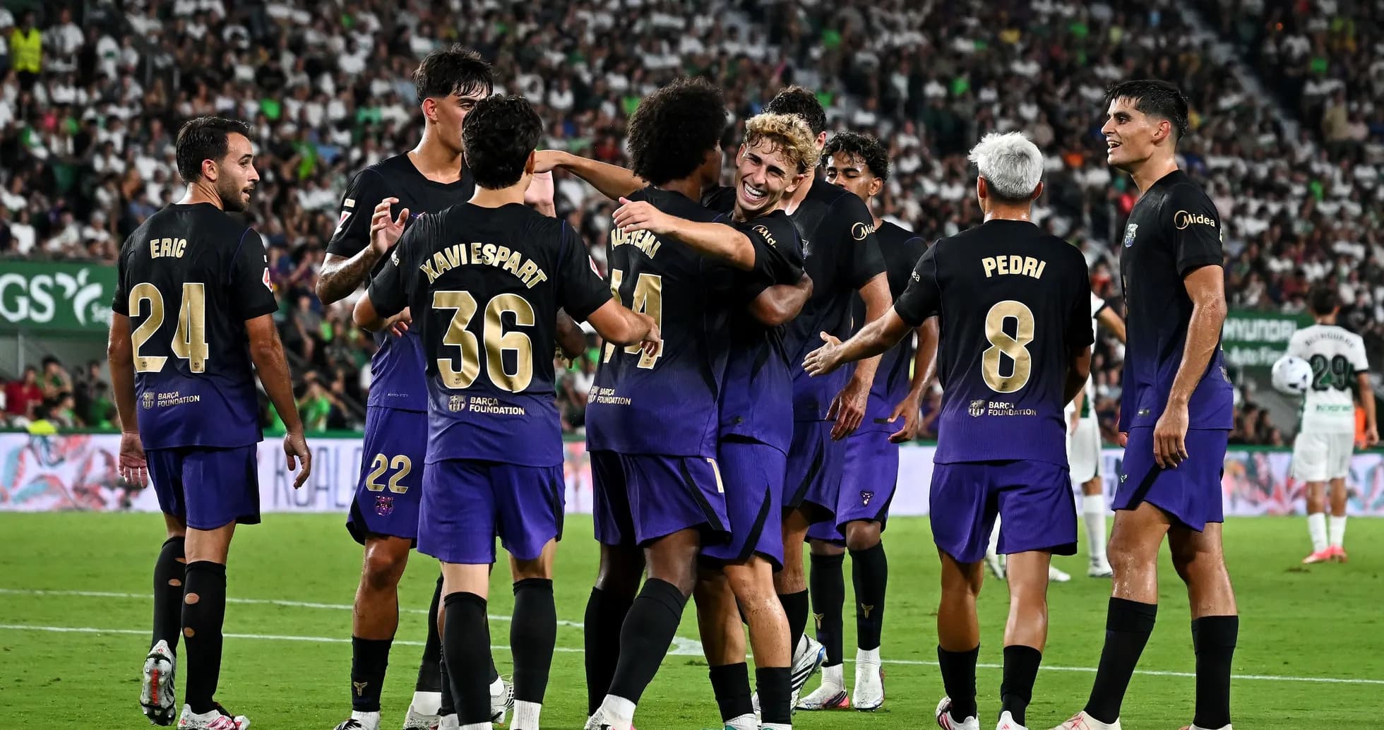 Barcelona players celebrating a goal during match