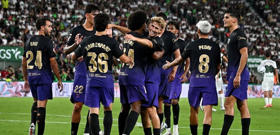 Barcelona players celebrating a goal during match