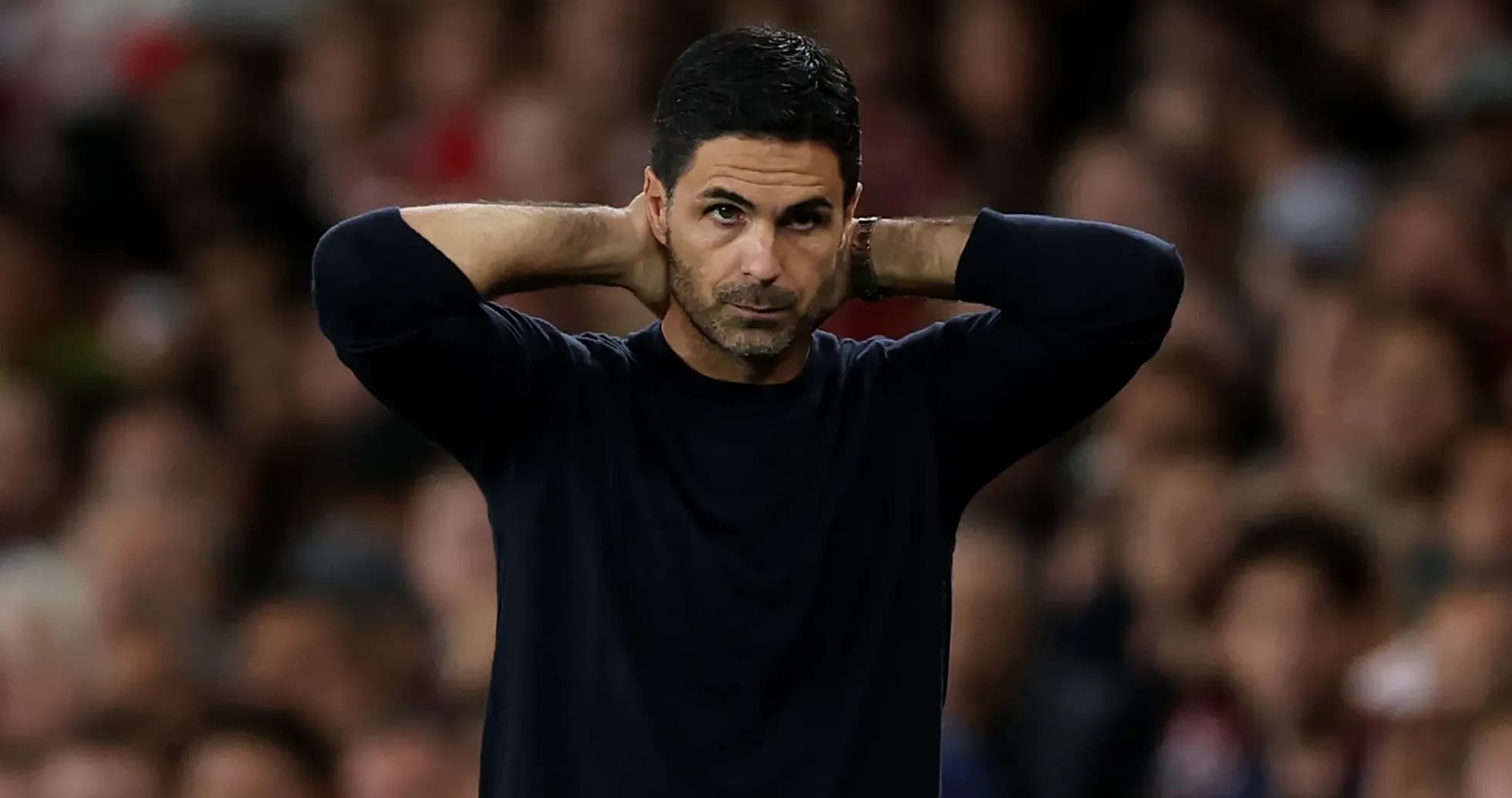 Manager with hands on head during match