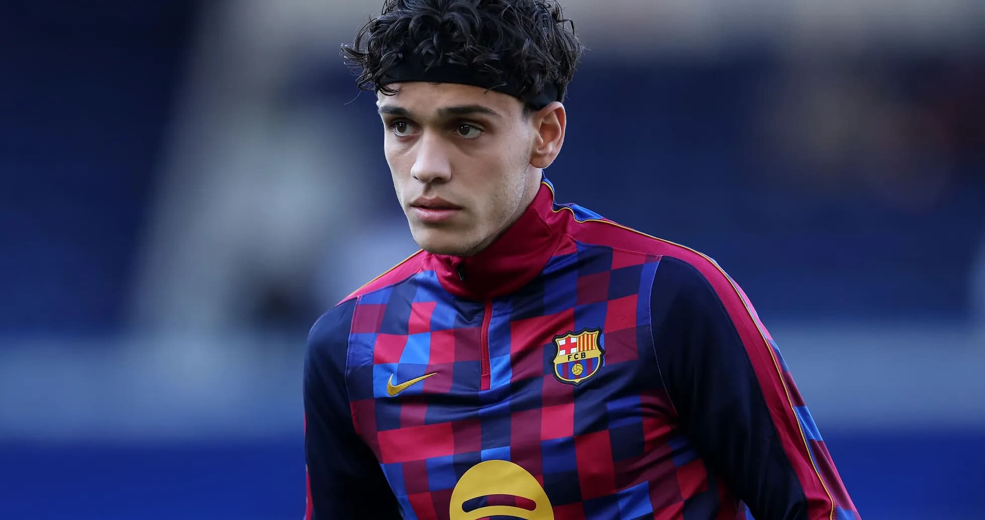Player warming up in Barcelona training kit