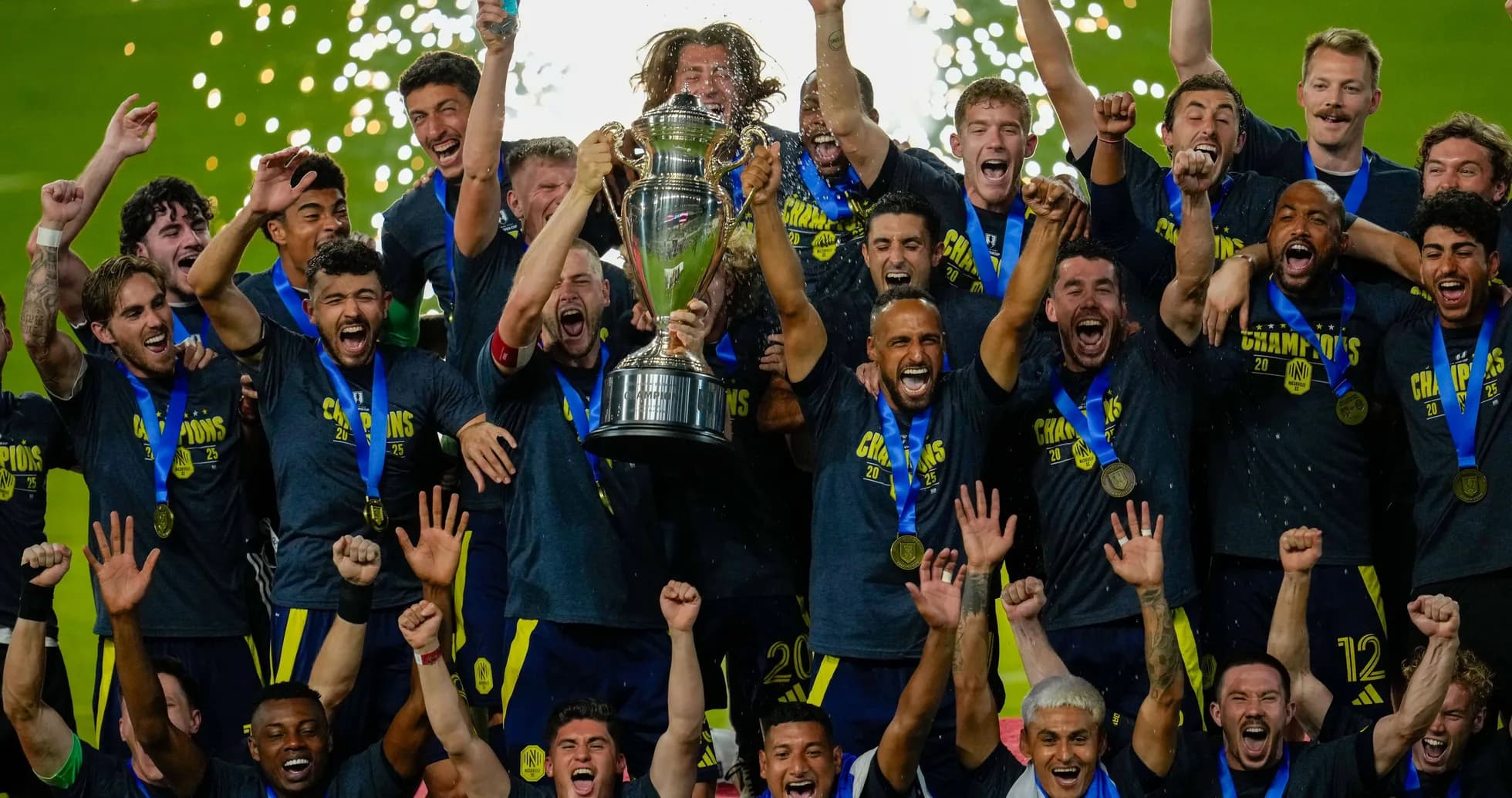 Team celebrating with trophy after championship victory