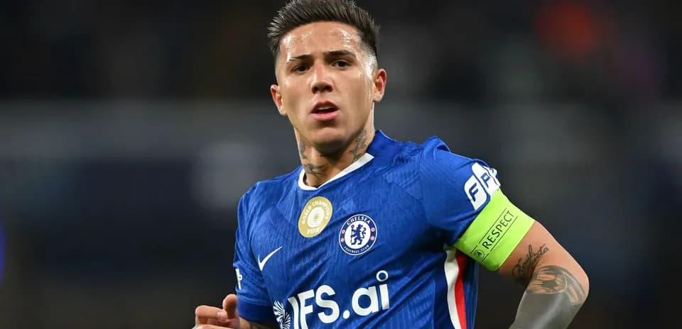 Player in blue jersey with captain's armband on field