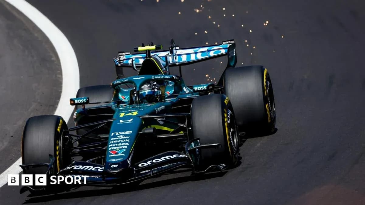 Car 14 racing on track with sparks flying
