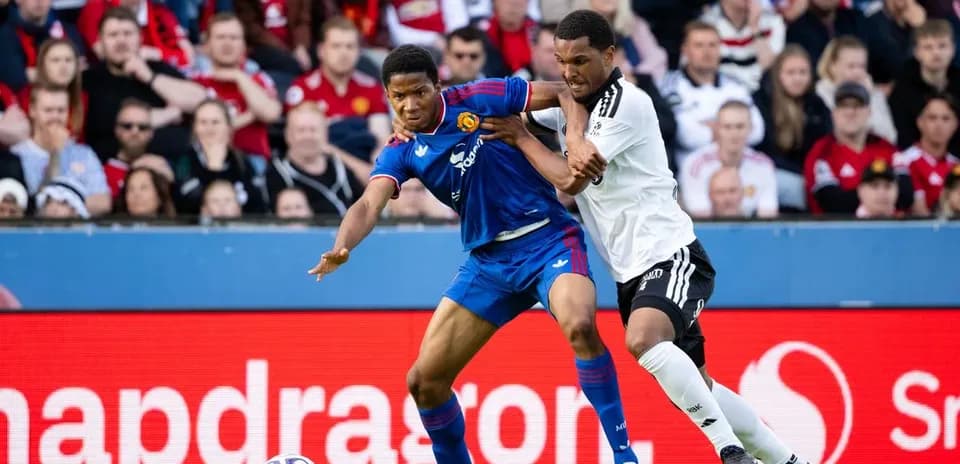Two players contesting the ball during a match