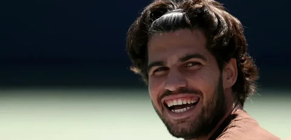 Smiling male tennis player during practice session