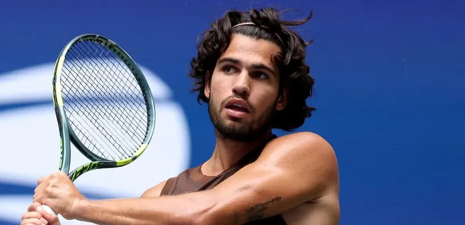 Player preparing to hit a tennis ball