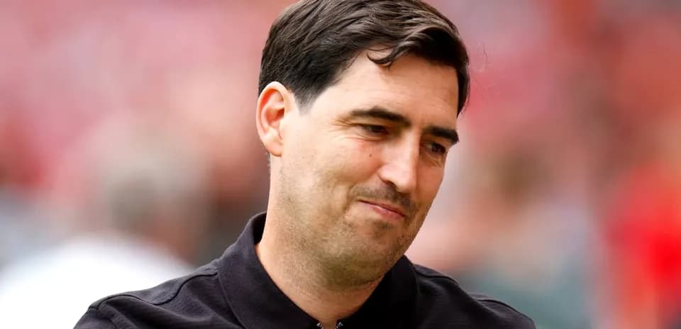 Coach smiling during a pre-match event