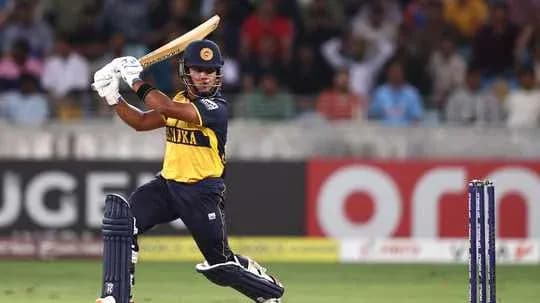 Batsman hitting ball during cricket match