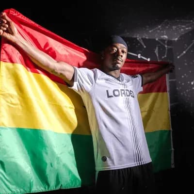 Athlete holding Bolivian flag in sports jersey