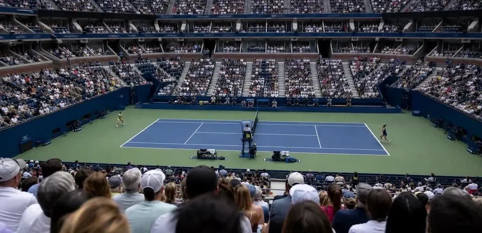 Tennis match in stadium with large audience