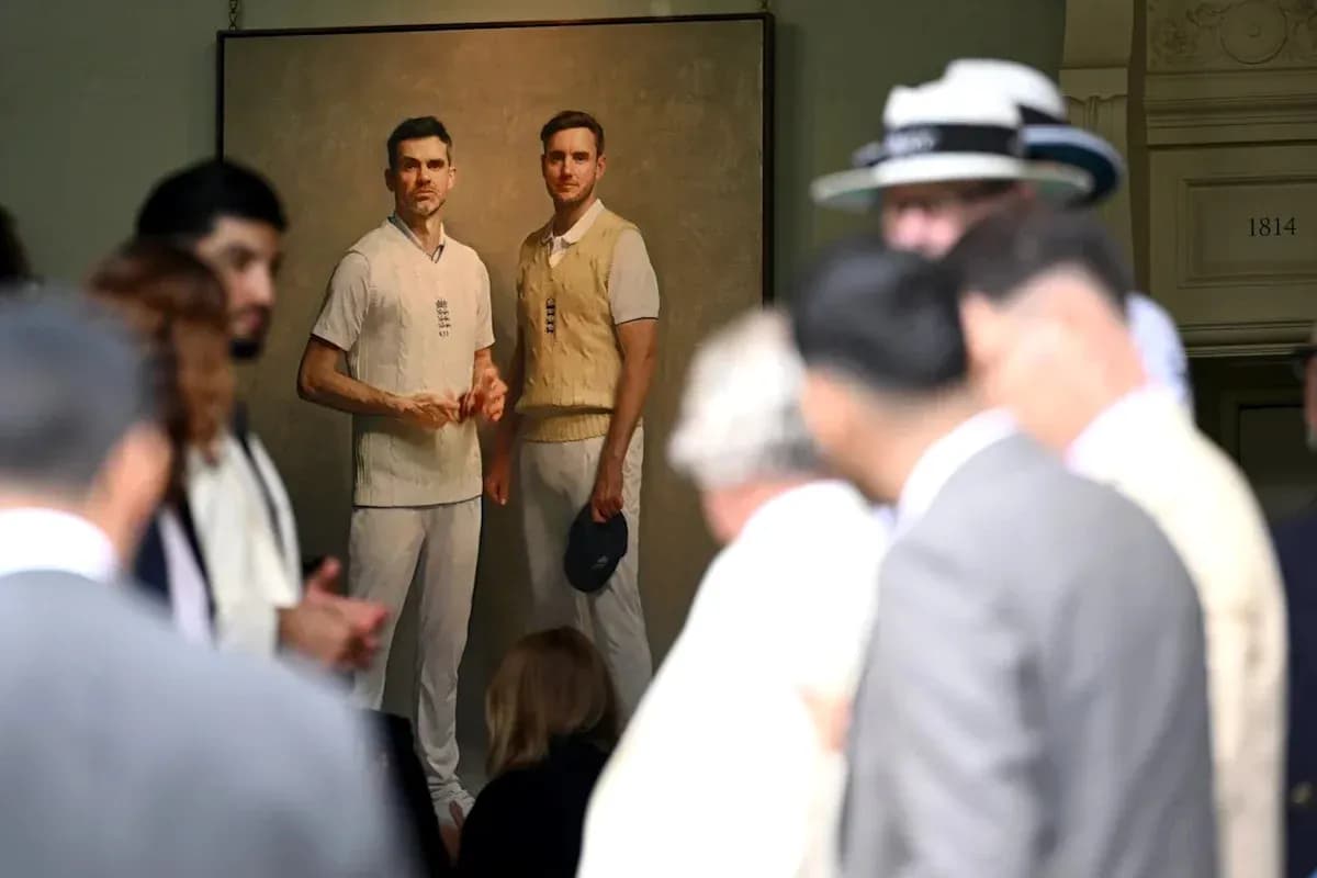 Crowd gathered around painting of two cricketers