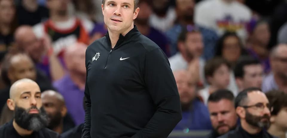 Coach observing game from the sidelines during match