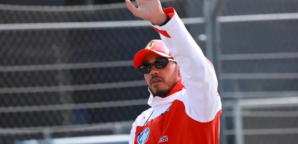 Driver waving during an event at the racetrack