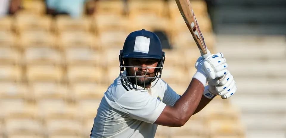 Batsman preparing to hit the ball in cricket match