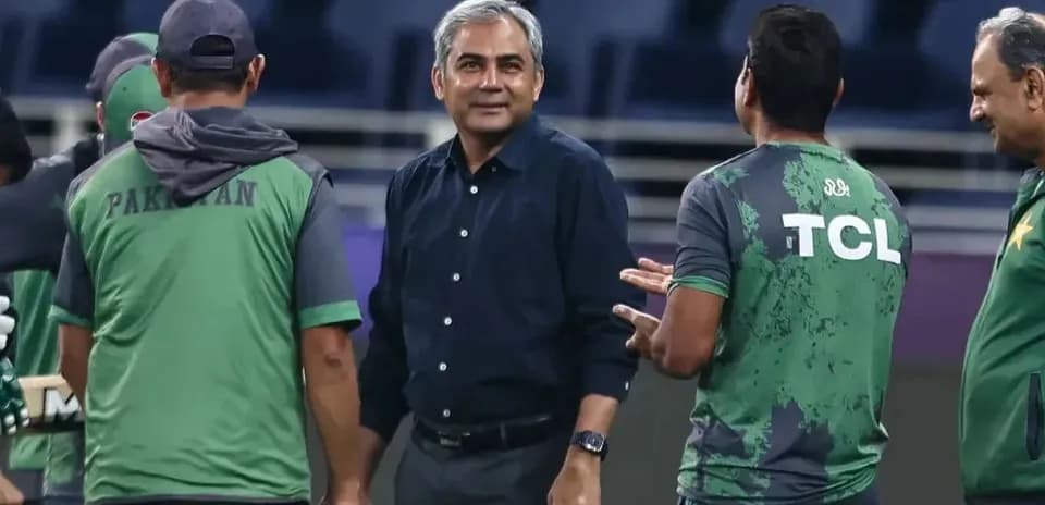 Cricket team discussing strategy during training session
