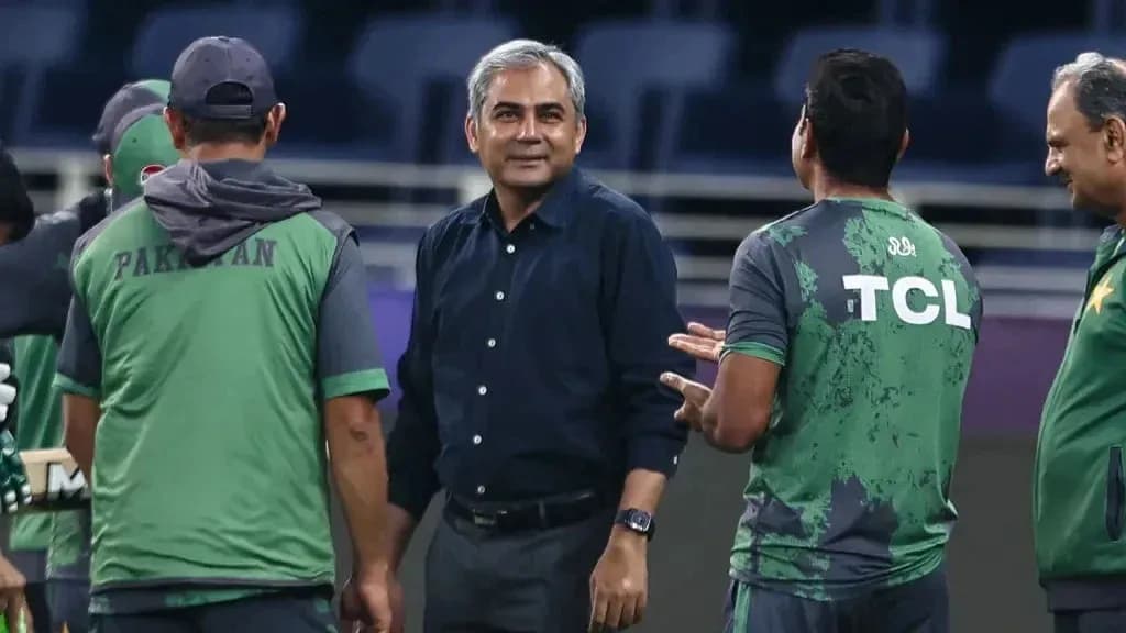 Cricket team discussing strategy during training session