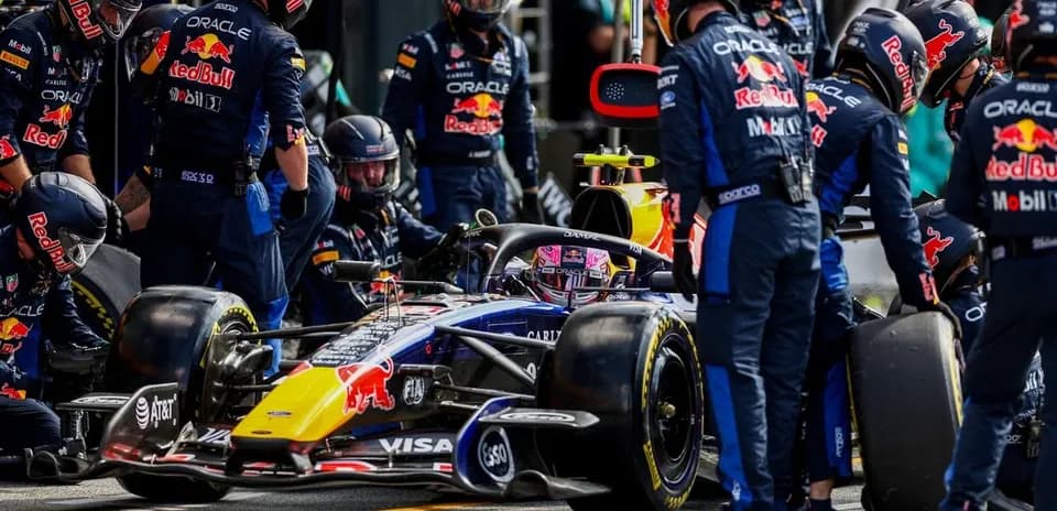 Red Bull Racing team servicing car in the pit