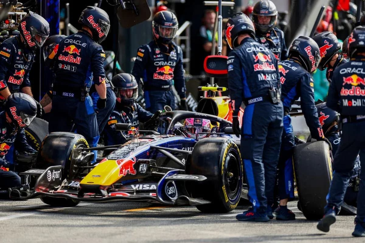 Red Bull Racing team servicing car in the pit