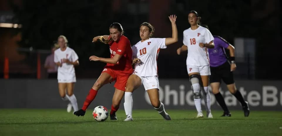 Players competing for the ball during soccer match