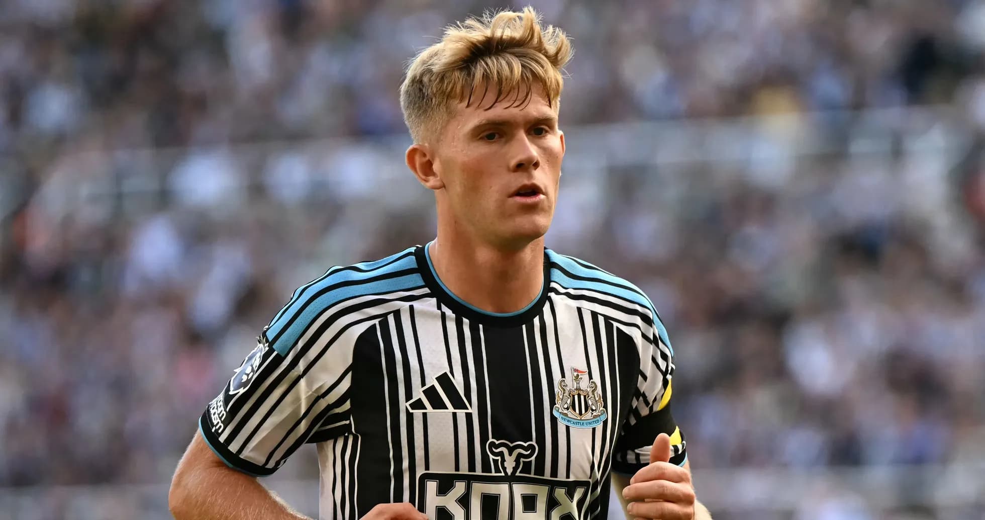 Newcastle player in black and white striped jersey
