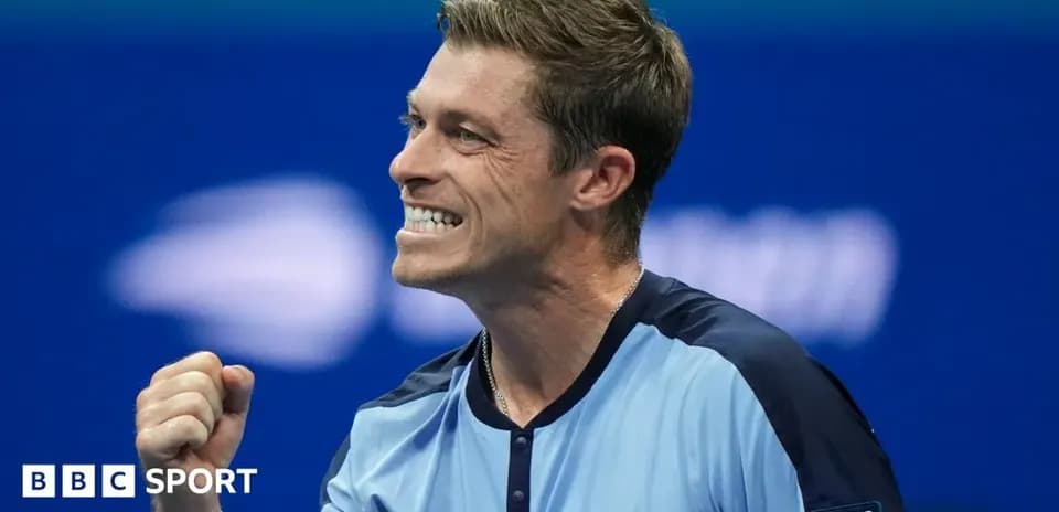 Tennis player celebrating a victory with clenched fist