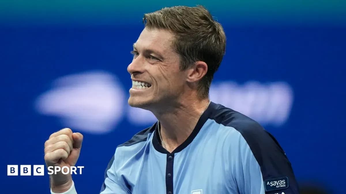 Tennis player celebrating a victory with clenched fist
