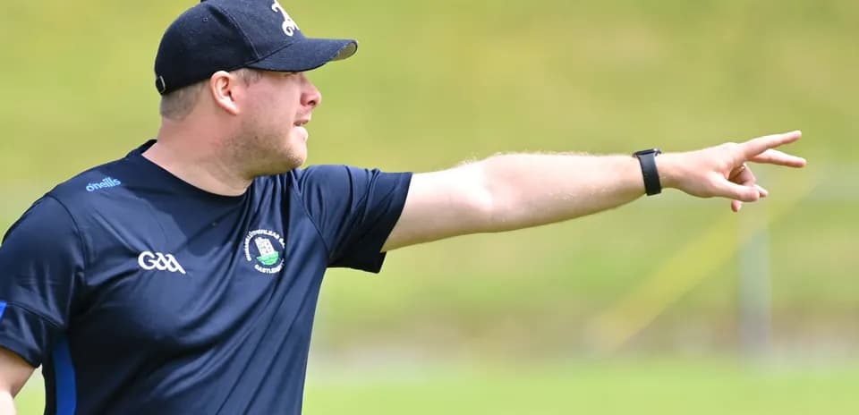 Coach directing players during training session