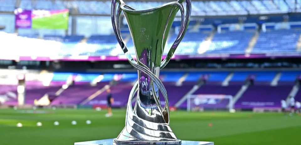 Trophy displayed on the pitch before the match