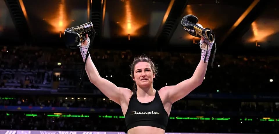 Athlete celebrating victory with boxing gloves raised