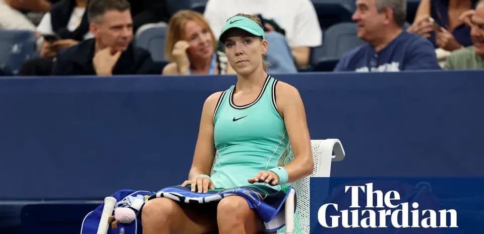 Tennis player seated during a match at stadium