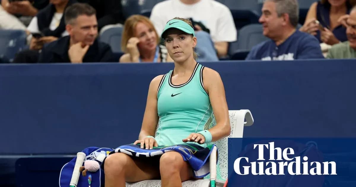 Tennis player seated during a match at stadium