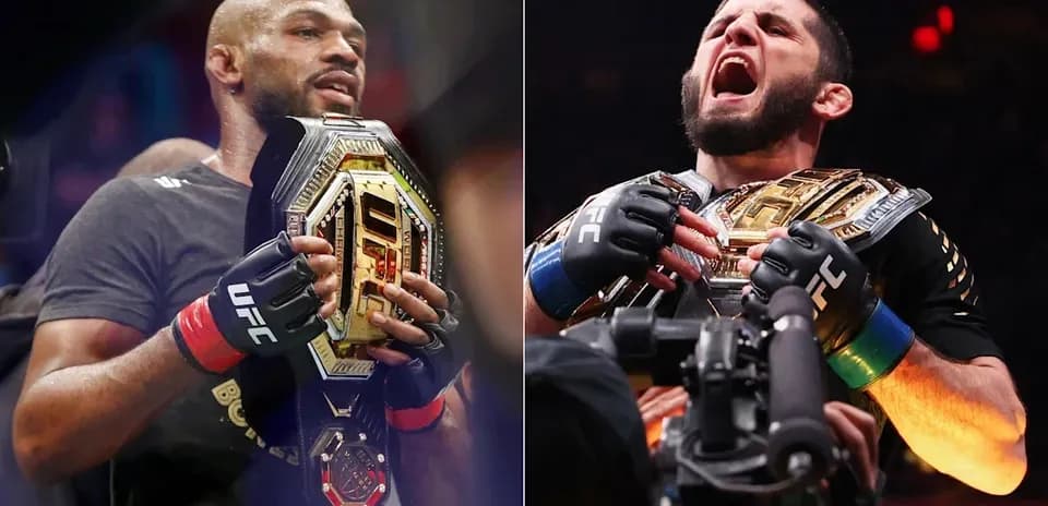 Two UFC fighters holding championship belts