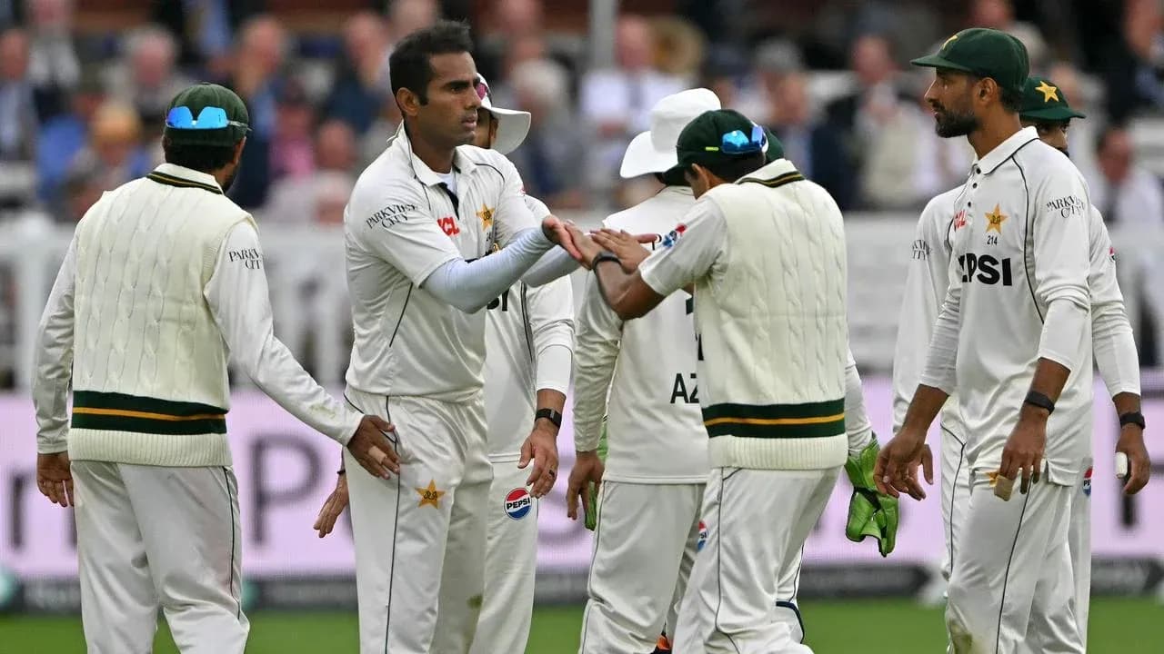Pakistani cricket team celebrating a wicket on field