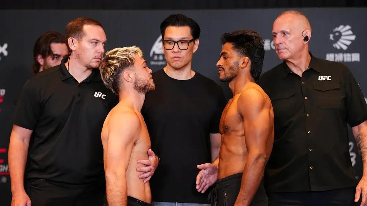Two fighters facing off at weigh-in event