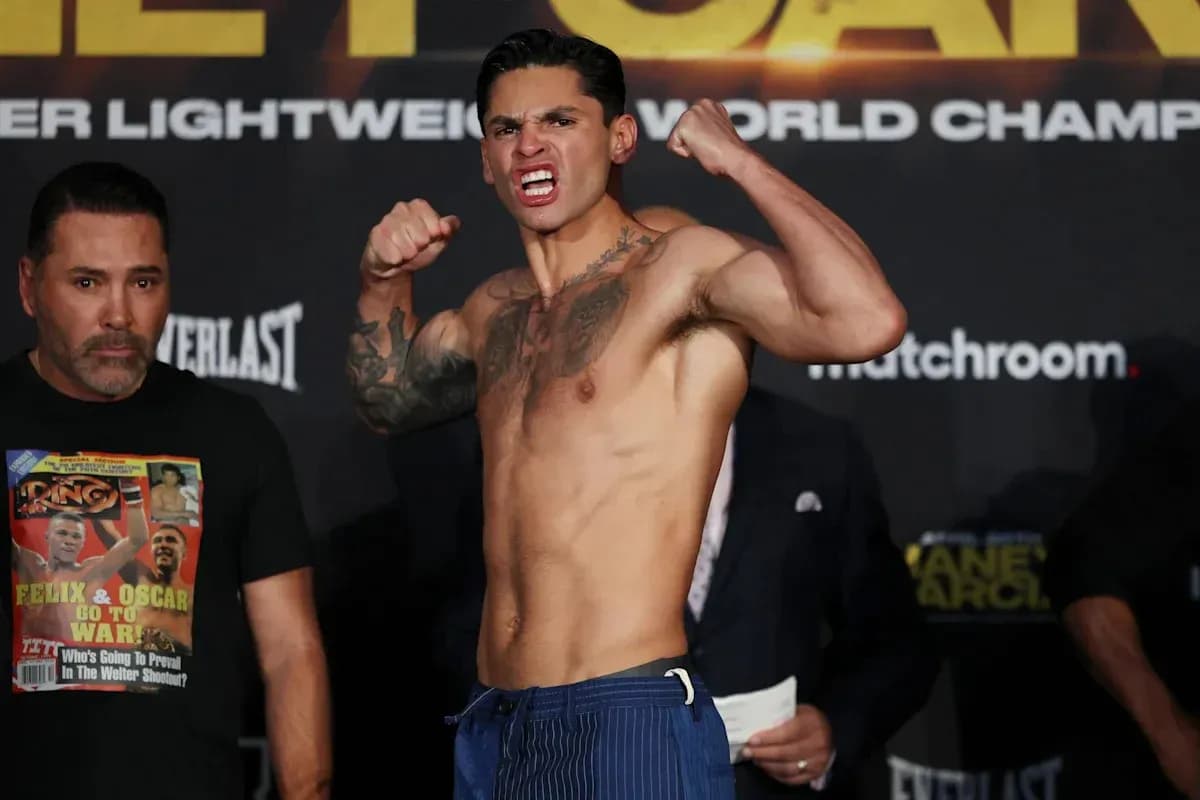 Boxer posing during weigh-in event with team member