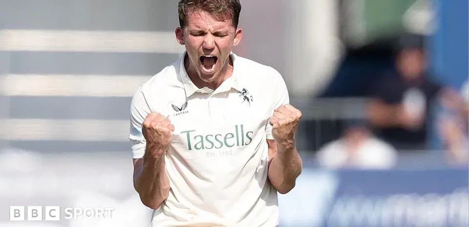 Cricketer celebrating a wicket with clenched fists
