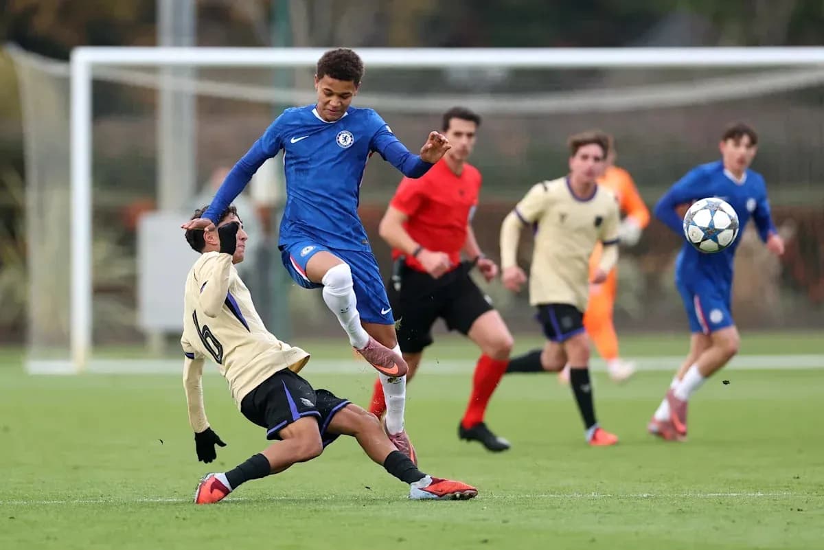 Chelsea player evading a tackle during youth match
