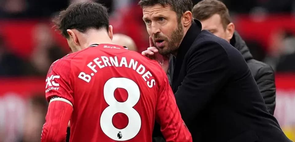Manager giving instructions to player on sidelines