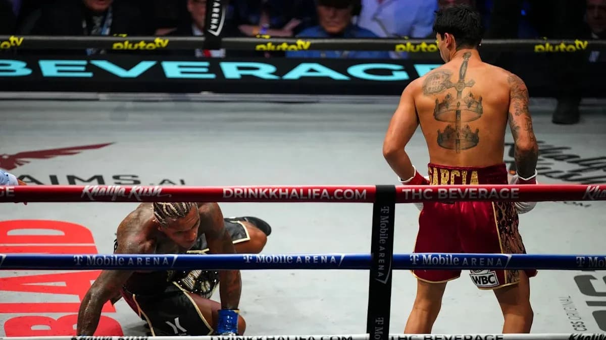 Boxer on the canvas with opponent standing nearby