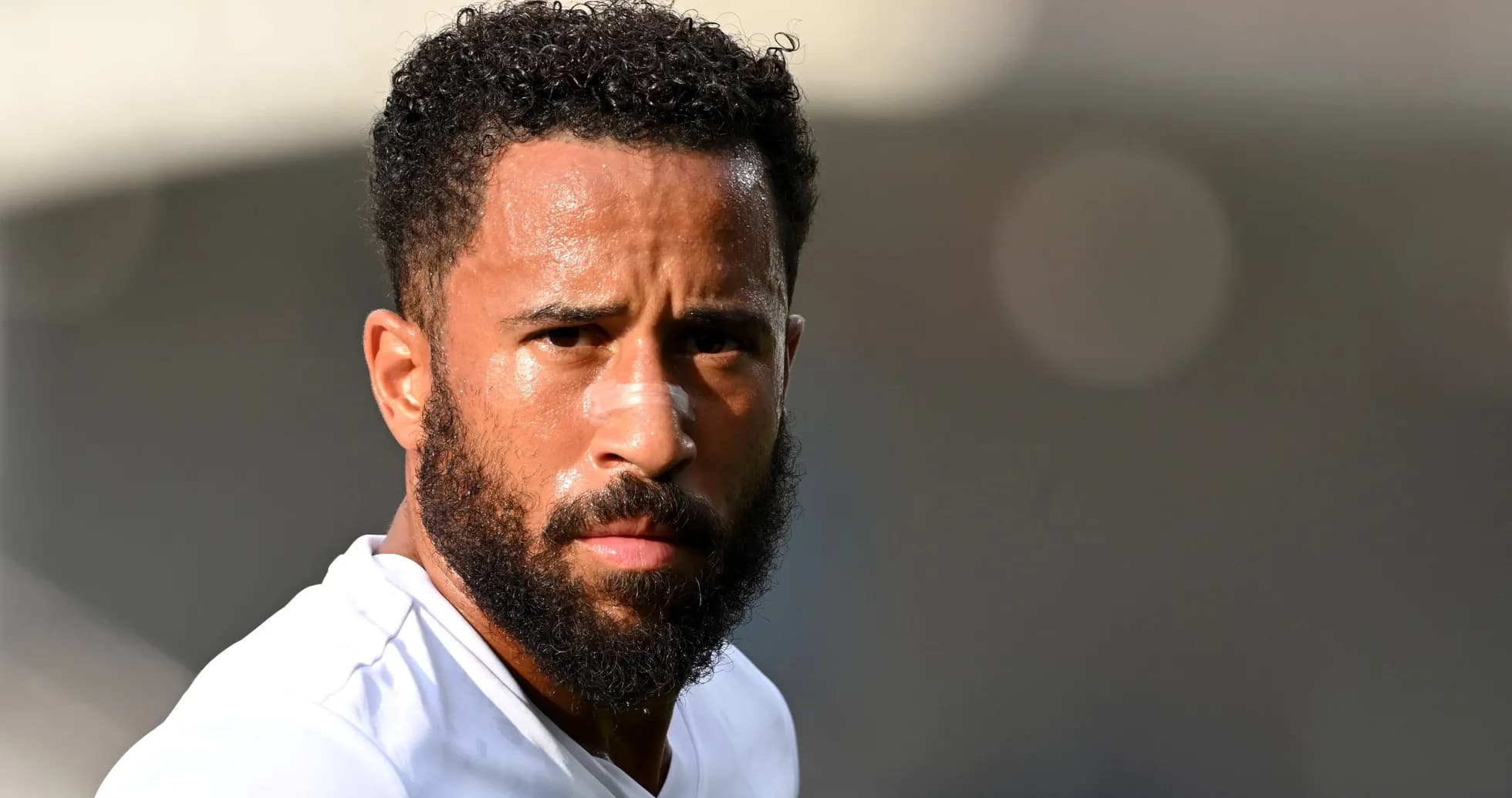 Player with a beard looking directly at camera