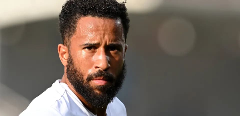Player with a beard looking directly at camera