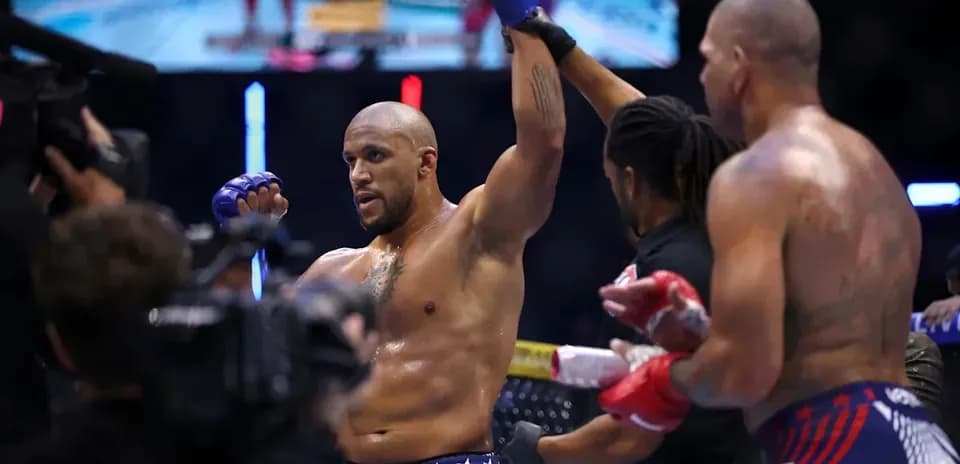 Fighter celebrating victory in the octagon