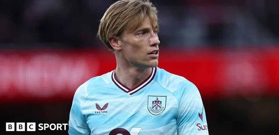 Player in light blue Burnley kit during match