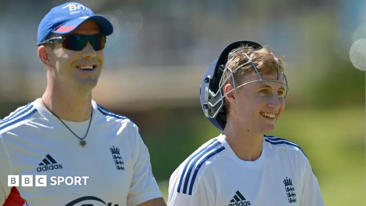 Two cricketers smiling during training session