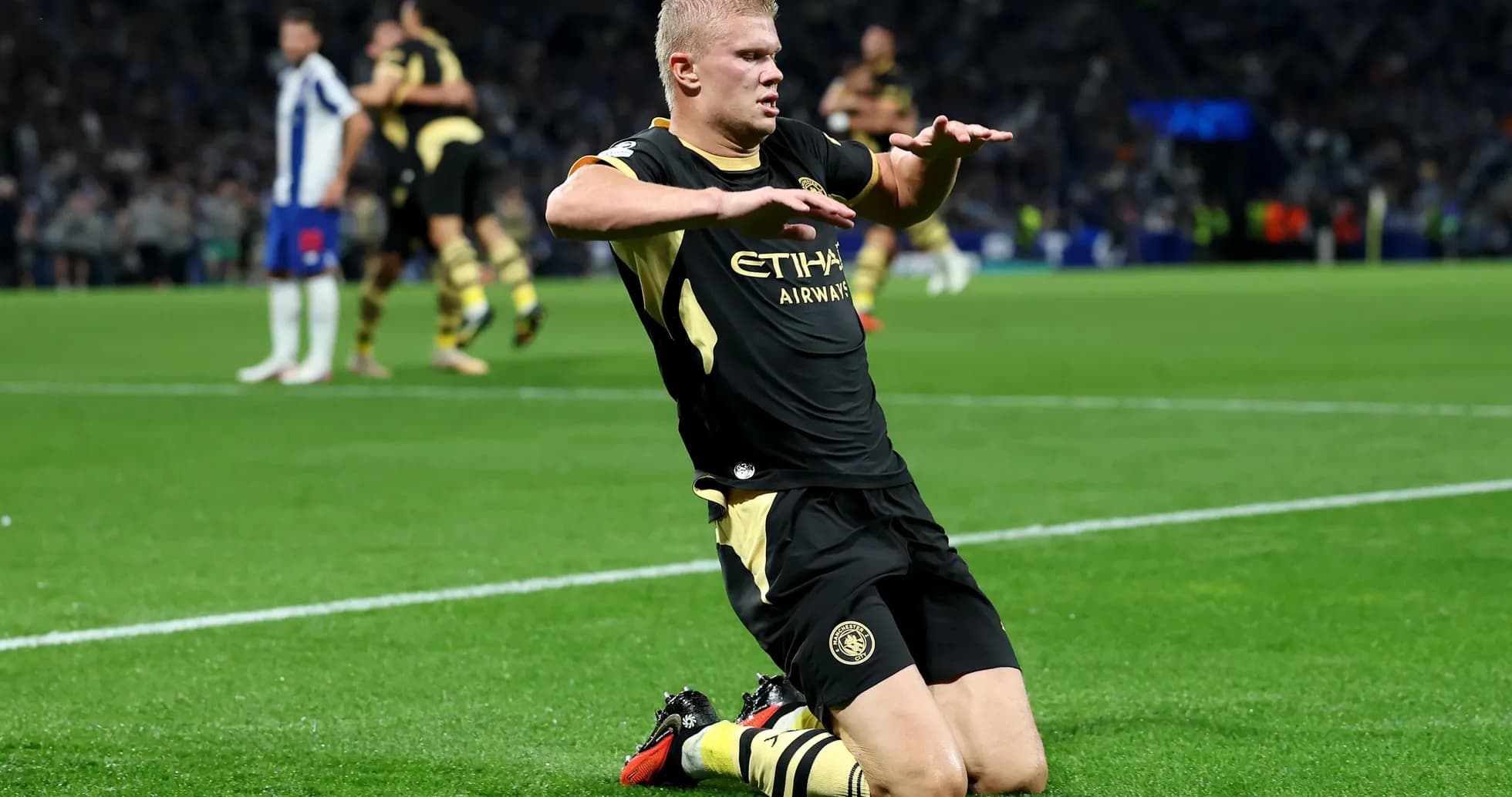 Player celebrating on the pitch after scoring goal