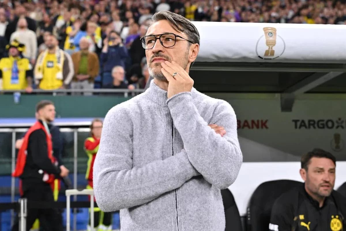 Coach observing match from the sidelines