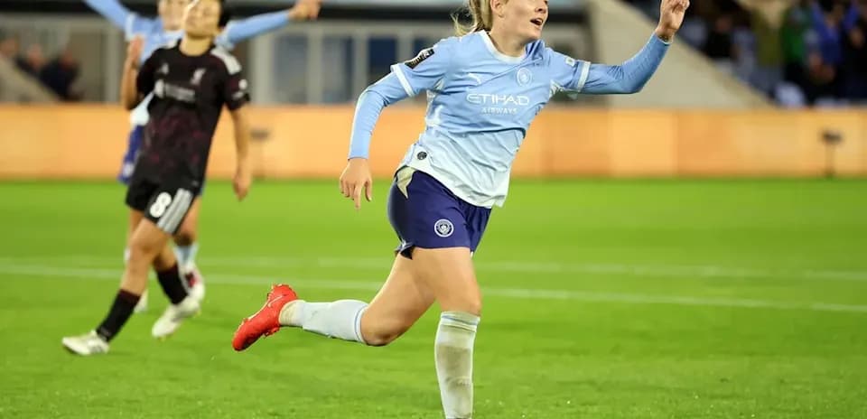 Player celebrating a goal on the pitch