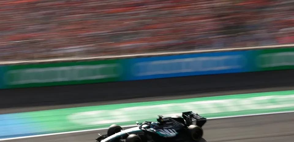 Formula 1 car racing on track with blurred background